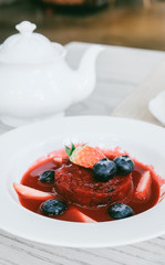 Summer pudding with berries and sauce