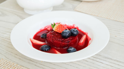 Summer pudding with berries and sauce