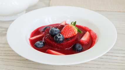 Summer pudding with berries and sauce