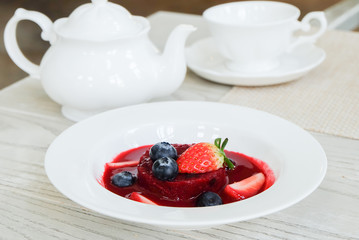 Summer pudding with berries and sauce