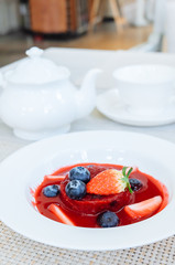 Summer pudding with berries and sauce