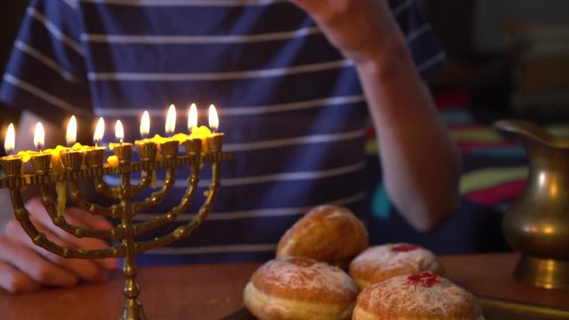 Jelly donuts are one of the most symbolic dishes of Hanukkah. Candles on the menorah