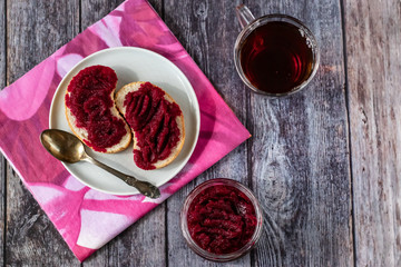 Sandwiches with natural homemade beetroot jam, with vanilla and sugar. On a stormy napkin. Healthy food, vegetarianism.