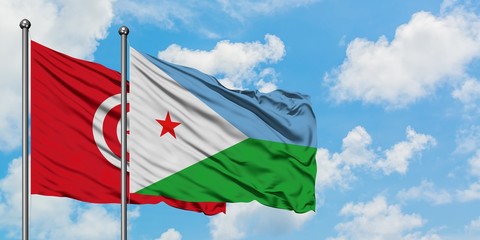 Tunisia and Djibouti flag waving in the wind against white cloudy blue sky together. Diplomacy...
