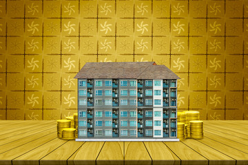  Start creating family with top table condominium and coin on golden leaves pattern background,Dream family concepts