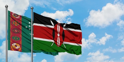 Turkmenistan and Kenya flag waving in the wind against white cloudy blue sky together. Diplomacy...