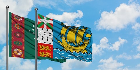 Turkmenistan and Saint Pierre And Miquelon flag waving in the wind against white cloudy blue sky together. Diplomacy concept, international relations.