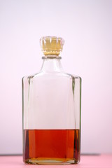 glass of whiskey and ice on wooden table