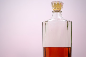 glass of whiskey and ice on wooden table