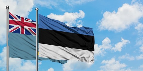 Tuvalu and Estonia flag waving in the wind against white cloudy blue sky together. Diplomacy...