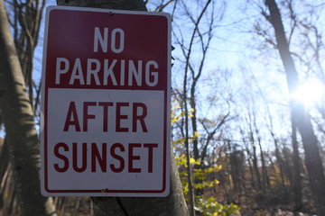 No Parking After Sunset Sign