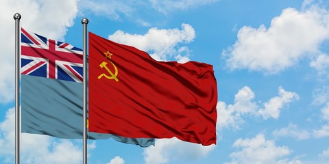 Tuvalu and Soviet Union flag waving in the wind against white cloudy blue sky together. Diplomacy...