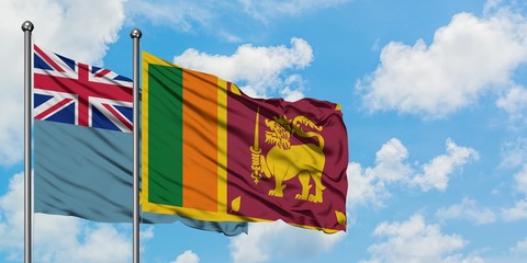 Tuvalu and Sri Lanka flag waving in the wind against white cloudy blue sky together. Diplomacy concept, international relations.