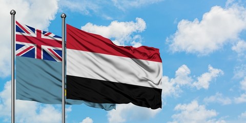 Tuvalu and Yemen flag waving in the wind against white cloudy blue sky together. Diplomacy concept, international relations.