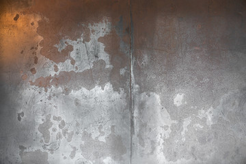 Weathered metal in black color with abstract oxidized effect in copper color