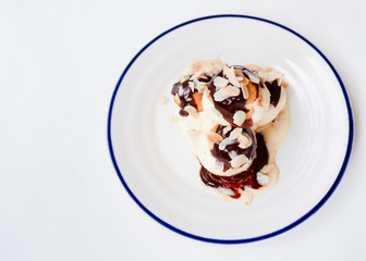 Choux pastry with vanilla ice cream and hot chocolate sauce
