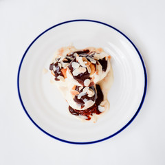 Choux pastry with vanilla ice cream and hot chocolate sauce