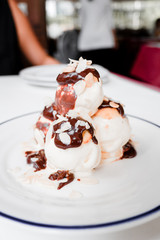 Choux pastry with vanilla ice cream and hot chocolate sauce