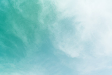 White cloud and blue sky background with copy space