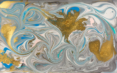 Blue marble pattern with golden glitter. Abstract liquid background.