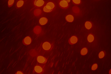 Dark Festive Christmas Beautiful abstract Background with bokeh lights. Holiday Texture with copy space. Can be used as Wallpaper, filling for a website, defocused