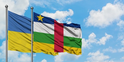 Ukraine and Central African Republic flag waving in the wind against white cloudy blue sky together. Diplomacy concept, international relations.