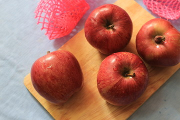 apples on wooden table