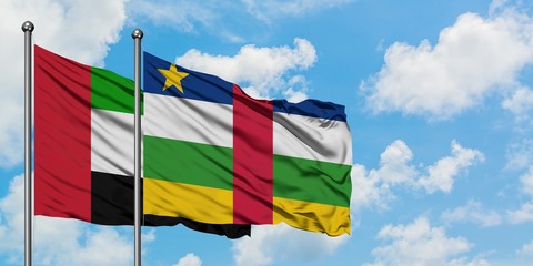 United Arab Emirates and Central African Republic flag waving in the wind against white cloudy blue sky together. Diplomacy concept, international relations.