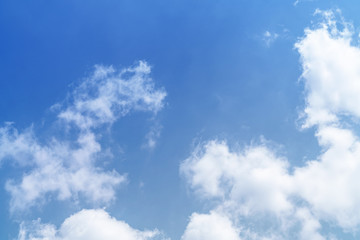 White cloud and blue sky background with copy space