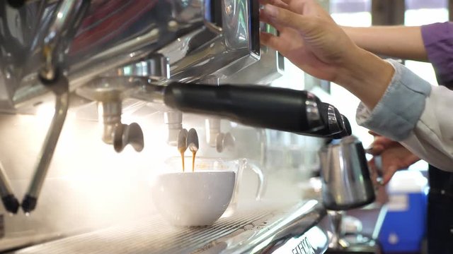 The coffee drops are dropped from the coffee maker machine. drink and beverage concept.