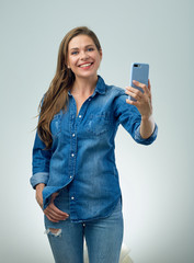 Fototapeta premium Happy young woman making self portrait photo
