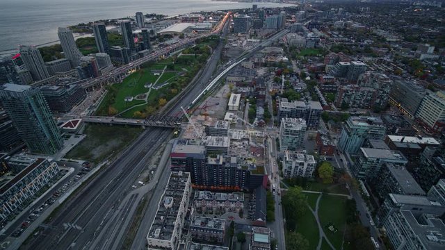 Toronto Ontario Aerial v23 Panning birdseye of Niagara, Fashion District with detail of parallel trains - October 2017