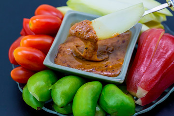 Raw mango slice with sweet dried shrimp sauce, Mango and Guava with sweet fish sauce is a delicious menu. Ancient thai food mango sweet fish sauce Street food in thailand