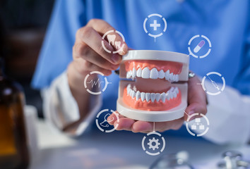 Dentistry and teeth treatment concept. Doctor in hospital with health insurance related icons in modern graphic interface icon.