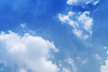 White cloud and blue sky background with copy space
