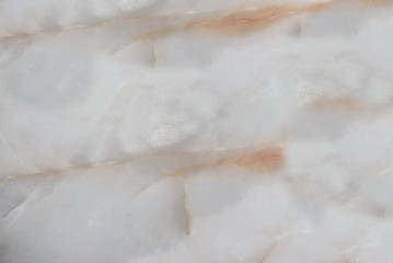 Patterns in the form of a star from marble of different colors, pink pattern on a light background, gray-white marble