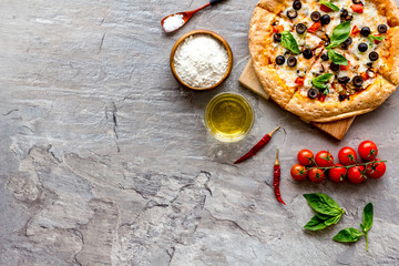 Traditional italian food: pizza on grey background top view copy space