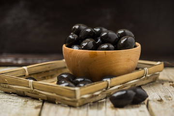 Black Olives in bowl and Virgin Olive Oil