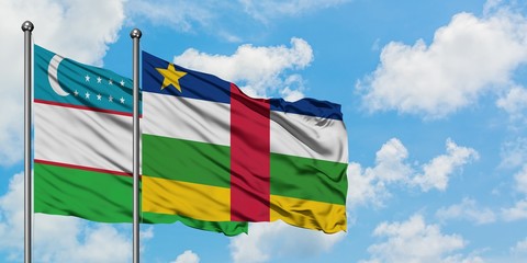 Uzbekistan and Central African Republic flag waving in the wind against white cloudy blue sky together. Diplomacy concept, international relations.