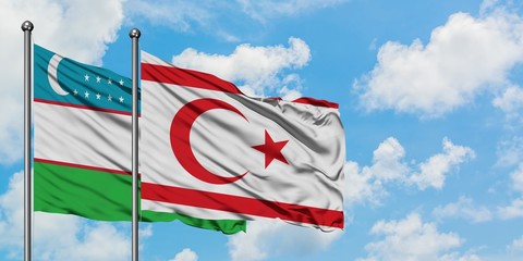 Uzbekistan and Northern Cyprus flag waving in the wind against white cloudy blue sky together. Diplomacy concept, international relations.