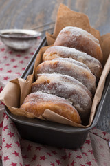 Homemade ring donuts on a rustic wooden background.  donuts with coffee candies on wooden background. Party food concept. 