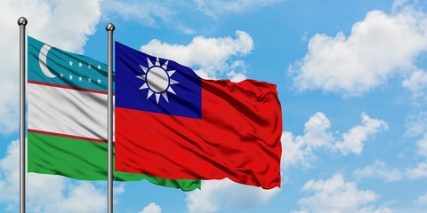 Fototapeta na wymiar Uzbekistan and Taiwan flag waving in the wind against white cloudy blue sky together. Diplomacy concept, international relations.