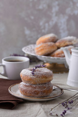 Homemade ring donuts on a rustic wooden background.  donuts with coffee candies on wooden background. Party food concept. 
