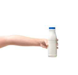 Kid Hand holding Bottle of fresh milk  isolated on white.