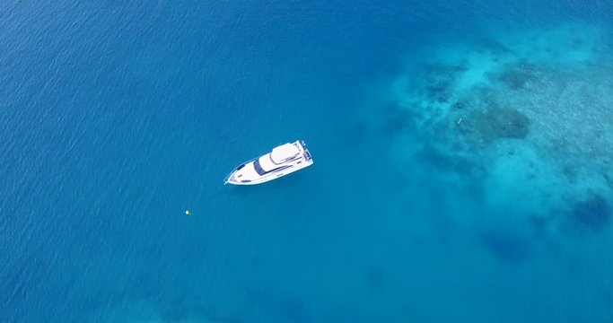 Top View of The White Sailing Boats in The Vast Blue Ocean in Thailand - Aerial Shot 
