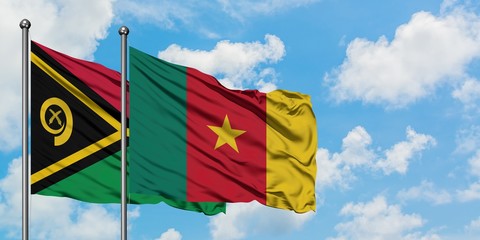 Vanuatu and Cameroon flag waving in the wind against white cloudy blue sky together. Diplomacy concept, international relations.