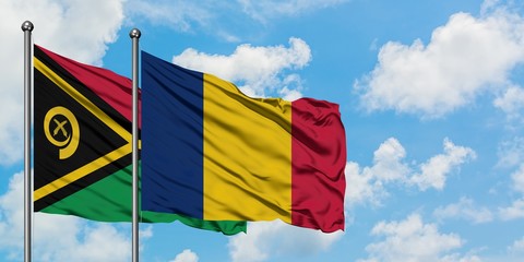 Vanuatu and Chad flag waving in the wind against white cloudy blue sky together. Diplomacy concept,...