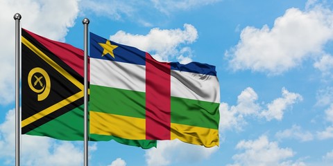 Vanuatu and Central African Republic flag waving in the wind against white cloudy blue sky...