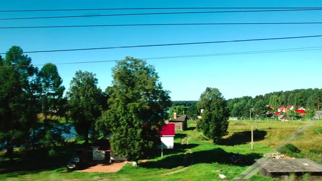 High-speed Train moves on a bridge over a river in the summer day