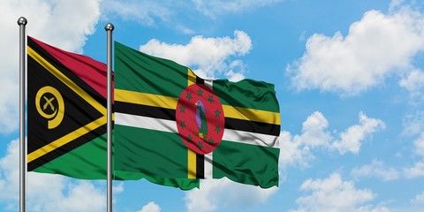 Vanuatu and Dominica flag waving in the wind against white cloudy blue sky together. Diplomacy...